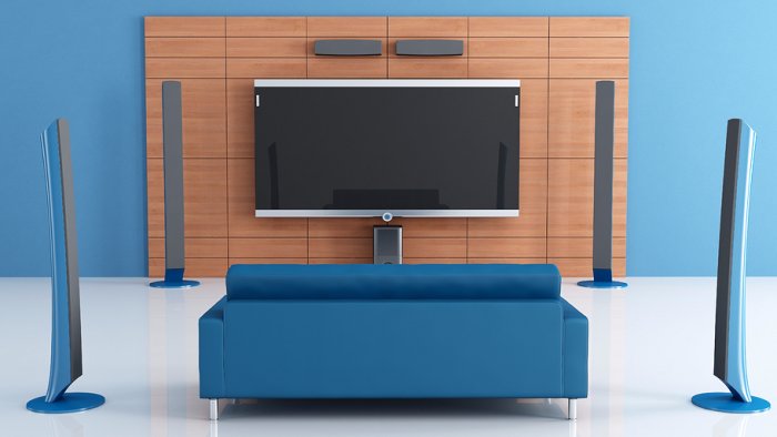 blue couch with surround sound and smart TV